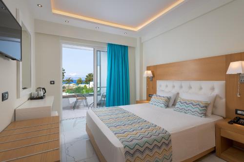 מיטה או מיטות בחדר ב-Oceanis Park Hotel