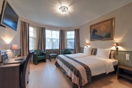 Voodi või voodid majutusasutuse Hotel Pavillon Du Zoute toas