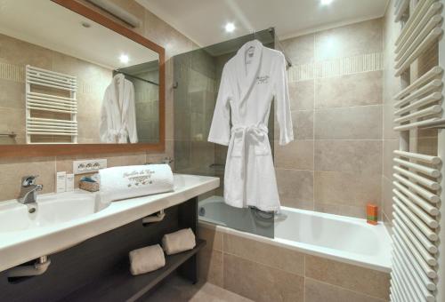Ett badrum på Hotel Pavillon Du Zoute