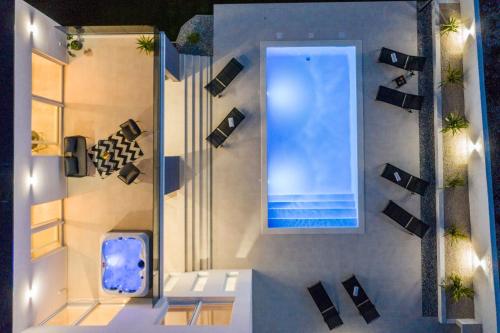 an overhead view of a swimming pool in a building at Villa Pollux - Adriatic Luxury Villas in Vrsi