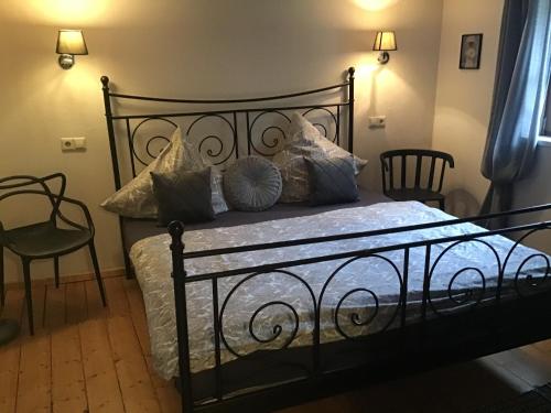 En eller flere senge i et værelse på Ferienhaus-Barz