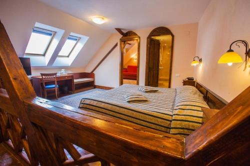 a bedroom with a large bed in a room at Casa Wagner in Braşov