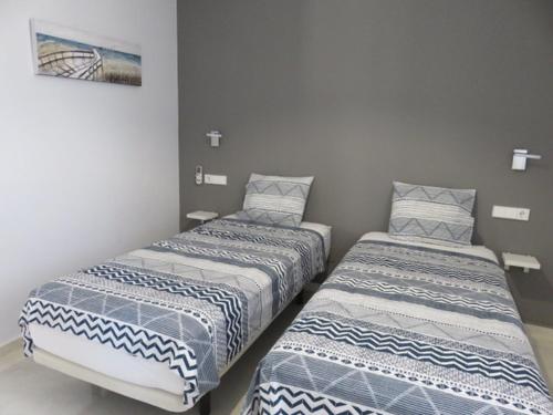 two beds sitting next to each other in a room at Sierra Y Mar in Mazarrón