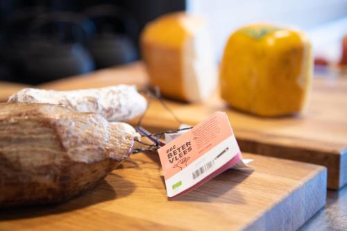 a loaf of bread sitting on a table with a tag at Notiz Hotel Leeuwarden in Leeuwarden
