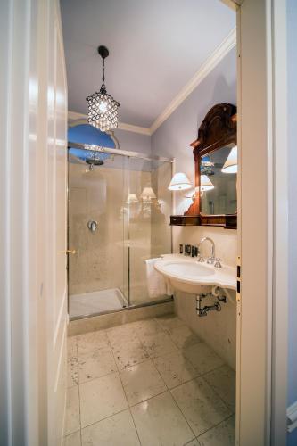 a bathroom with a sink and a shower at Palazzo Dalla Rosa Prati in Parma