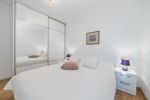 Posteľ alebo postele v izbe v ubytovaní Apartments Crystal