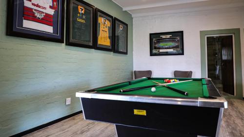 a billiard room with a pool table in it at Rooiberg Wild Private Game Reserve in Ladismith