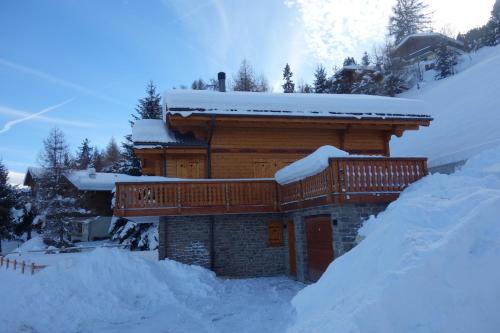 a log cabin with snow on the roof at Croix Noires FABULOUS & LUXURY chalet 11 pers by Alpvision Résidences in Vex