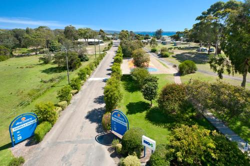 an overhead view of a road with trees and signs at Discovery Parks - Pambula Beach in Pambula