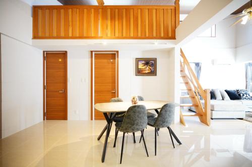 a dining room with a table and chairs at ITOMAN SEA pension OHDO #MIM in Ōdo