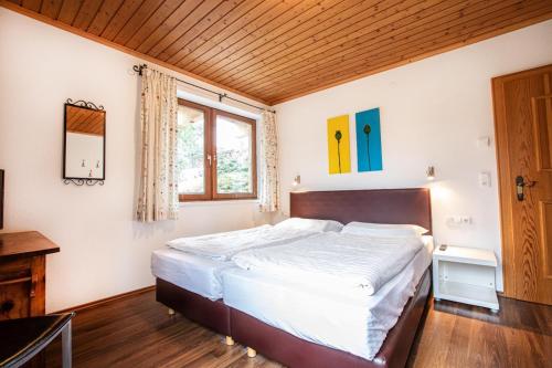 A bed or beds in a room at Chalet Hochkrimml 49