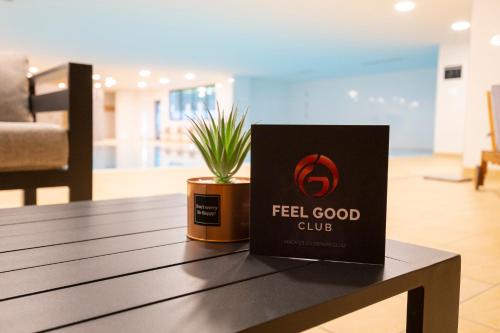 a box sitting on a table with a potted plant at Feel Good Hotel in Chemnitz