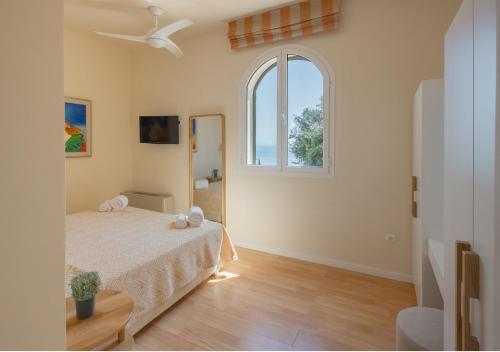 Giường trong phòng chung tại Villa Naldera