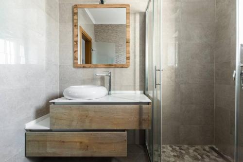 a bathroom with a sink and a mirror at Villa Azzurro in Vela Luka