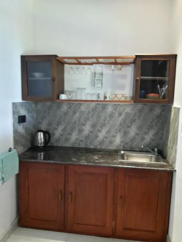 a kitchen with a sink and a counter top at Sapara River Guest in Bentota