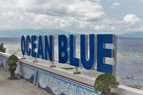 a sign for a ocean club on the beach at Ocean Terrace Suite And Spa Luxury in Nusa Penida