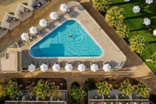 an overhead view of a swimming pool at a resort at Louis Paphos Breeze in Paphos City