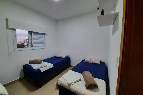 En eller flere senge i et værelse på FRODO-APTO MAGNÍFICO com Wifi , 2 dorm
