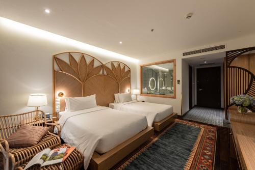 Ένα ή περισσότερα κρεβάτια σε δωμάτιο στο KK Sapa Hotel