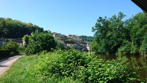 a view of a river from a train at Hôtel Grand Confort Le Moulin Rouge in Terrasson-Lavilledieu