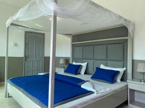 Posteľ alebo postele v izbe v ubytovaní Pelican Residence