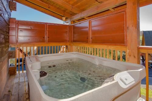 a jacuzzi tub in the middle of a house at Highland Dream, Hot Tub, FREE tickets each paid day, Near Dollywood, WIFI!!! in Sevierville