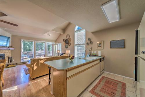 an open kitchen and living room with a couch at Cloudcroft Townhome with Deck - 1 Mi to Burro Ave! in Cloudcroft