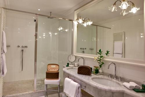 a bathroom with a large sink and a shower at Grand Hotel Majestic gia' Baglioni in Bologna