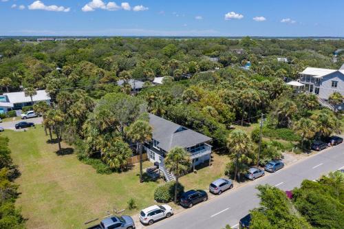 an aerial view of a house with cars parked in a parking lot at 306 E Arctic Ave. in Folly Beach