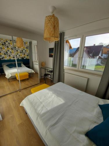 Posteľ alebo postele v izbe v ubytovaní Apartament Zielony