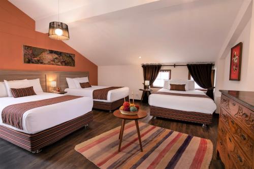 Tempat tidur dalam kamar di Atoq San Blas Hotel
