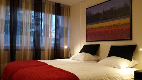 Łóżko lub łóżka w pokoju w obiekcie Bed and Breakfast Oosterpark
