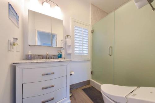 a bathroom with a sink and a shower at 1000#1 Contemporary Home w/ Parking, Grill, & AC! in Newport Beach