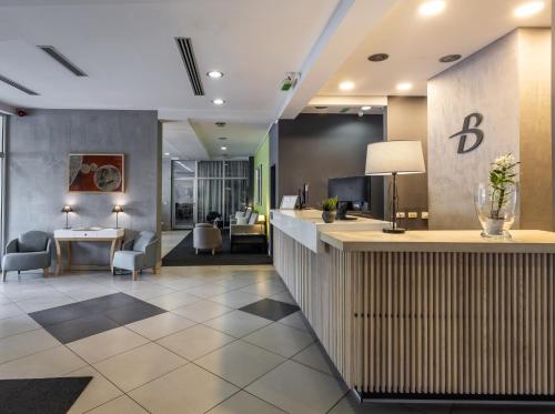 a lobby of a hotel with a reception desk at BLEECKER Hotels in Belgrade