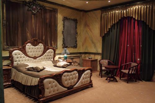 Krevet ili kreveti u jedinici u okviru objekta Alexandrapol Palace Hotel