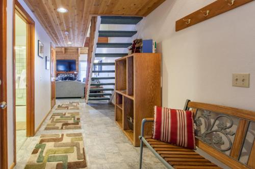 a hallway with a bench and stairs in a house at Val d'lsere # 21 in Mammoth Lakes