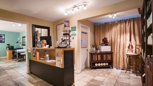 a shop with a counter and a table in a room at Best Western Gold Rush Inn in Whitehorse