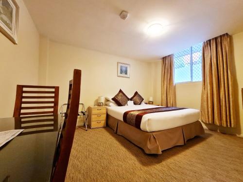 Katil atau katil-katil dalam bilik di Twin Towers Inn