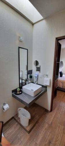 Ένα ή περισσότερα κρεβάτια σε δωμάτιο στο Hotel Del Valle