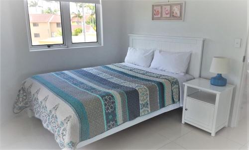 
A bed or beds in a room at The Emerald Surfers Paradise
