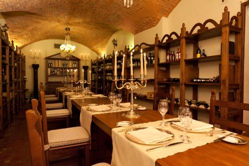 a dining room with a long table in a restaurant at Grand Hotel Majestic gia' Baglioni in Bologna