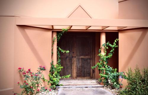 a entrance to a building with a wooden door at Casa Vista in Bangalow