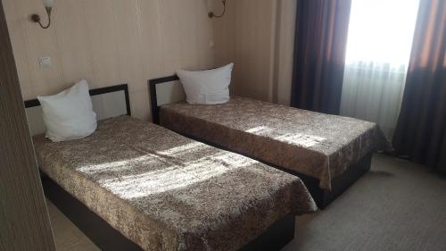  Кровать или кровати в номере Гостиница Бриз 