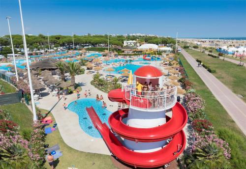 an amusement park with a water park with a water slide at Villaggio Turistico Internazionale in Bibione