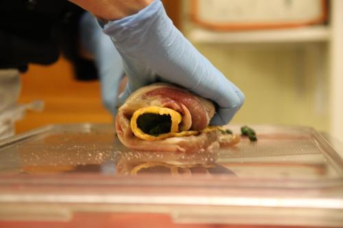 a person holding a sandwich in a plastic container at Hotel 2 Camini in Baselga di Pinè
