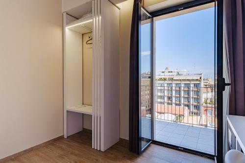 a room with a view of a city at Hotel Boston in Bari