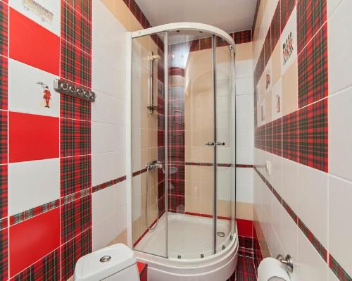 a bathroom with a shower and a toilet at Apart-studio Piligrim on Popova 33A in Yekaterinburg