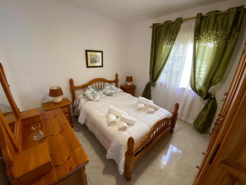 Postel nebo postele na pokoji v ubytování Casa Noni