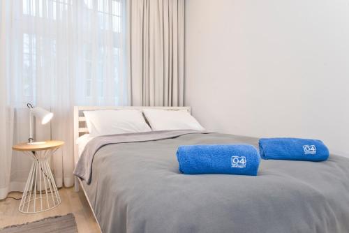 Posteľ alebo postele v izbe v ubytovaní Apartamenty Grobla III Q4Apartments