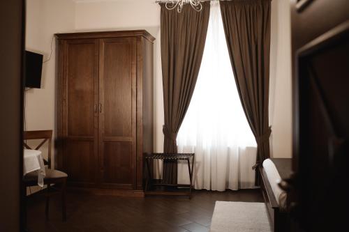a living room with a cabinet and a window at Ekaterinoslav in Dnipro